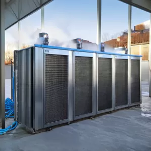 Community-Wide District Heating System Powered by 60kW Air Source Heat Pumps Community-Wide District Heating System Powered by 60kW Air Source Heat Pumps